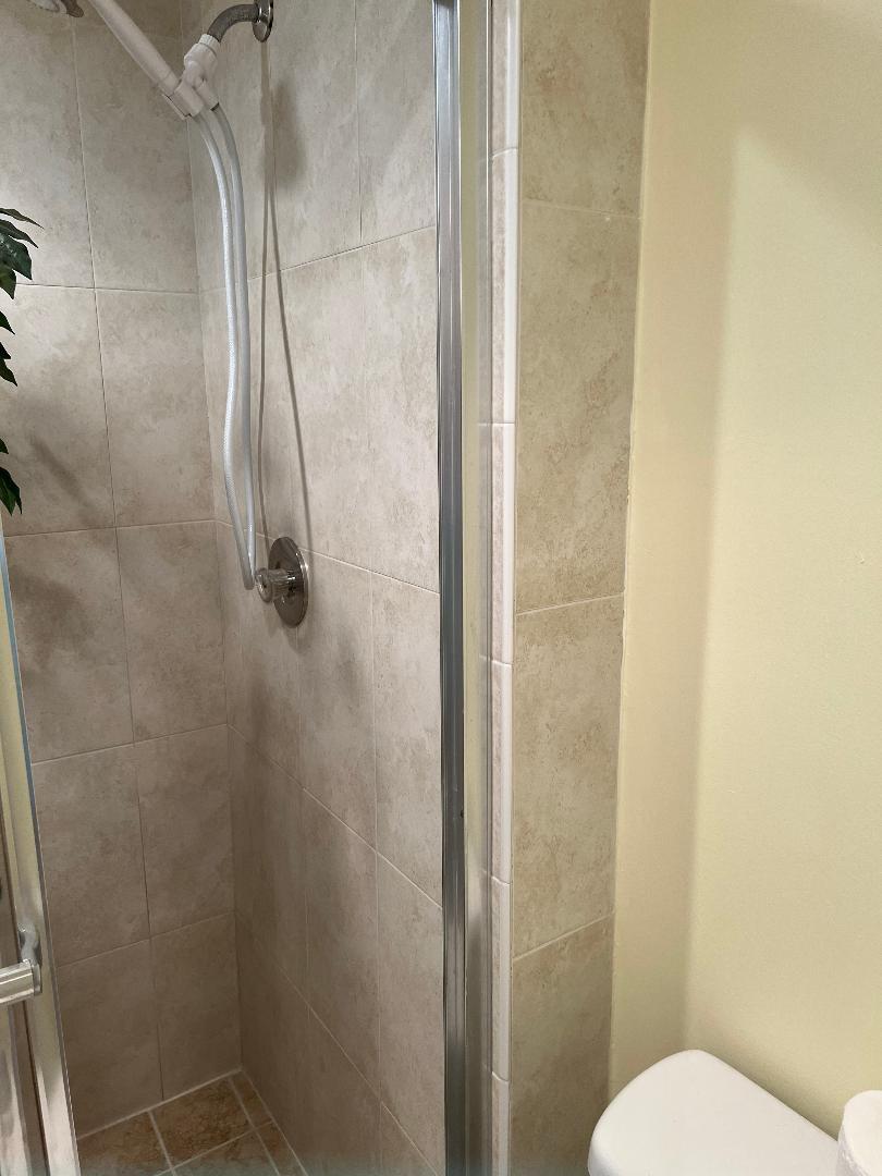 5403 Southeast Miles Grant Road, Unit 108 Stuart, FL 34997 - Photo 5 of 15 a bathroom with a shower and toilet