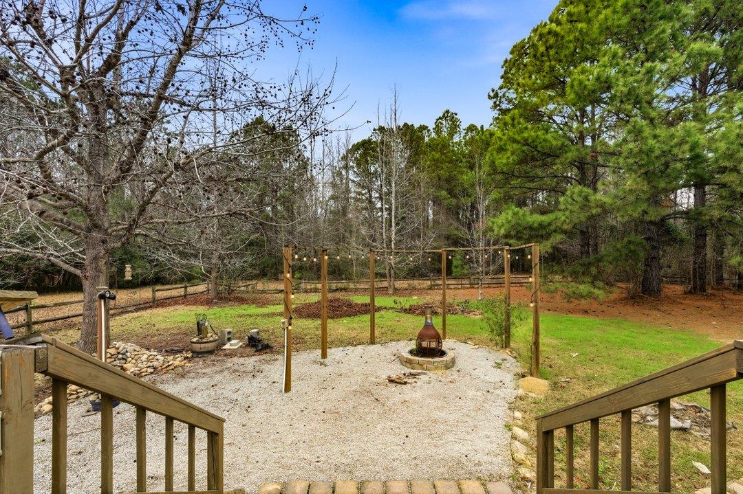 181 EV Road Loris, SC 29569 - Photo 29 of 33 View of grassy yard featuring an outdoor fire pit