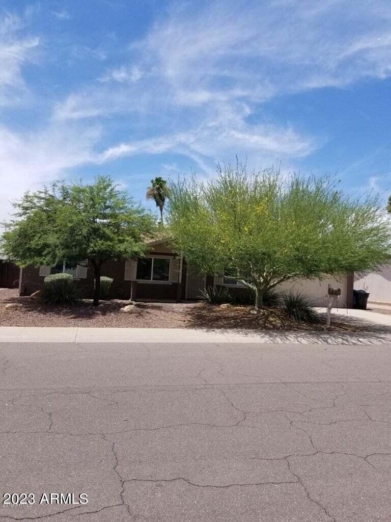 14420 North 39th Way Phoenix, AZ 85032 - Photo 1 of 24 a front view of a house with a yard and a garage
