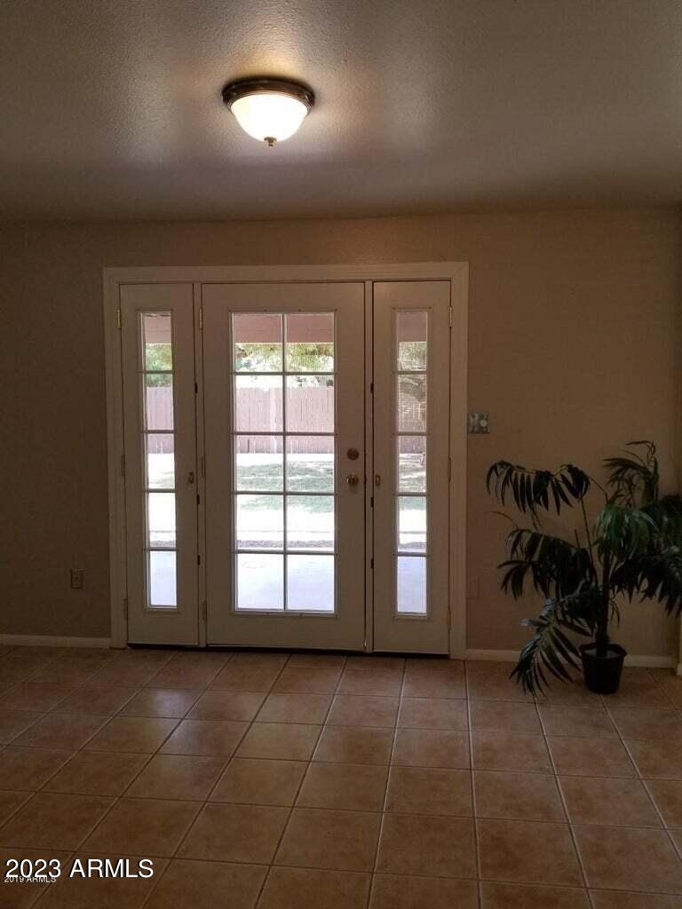 14420 North 39th Way Phoenix, AZ 85032 - Photo 11 of 24 an empty room with windows
