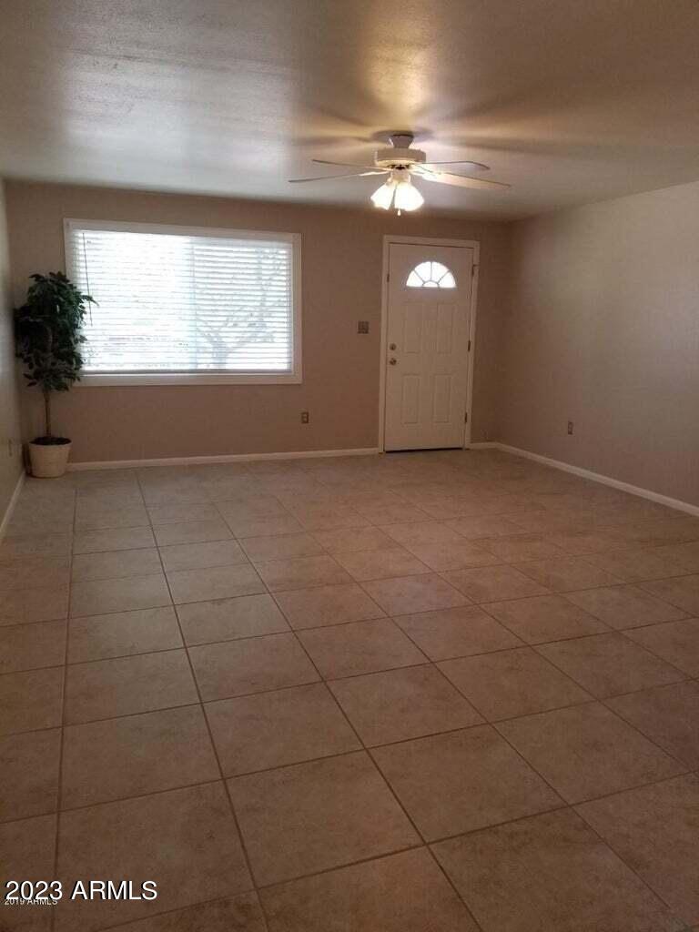 14420 North 39th Way Phoenix, AZ 85032 - Photo 16 of 24 a view of an empty room with a window
