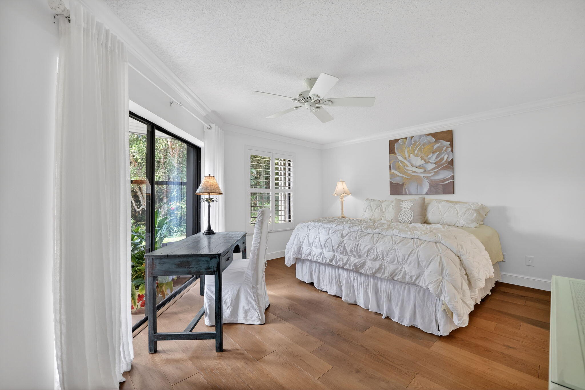 3401 Southeast Martinique Trace, Unit 102 Stuart, FL 34997 - Photo 19 of 56 a bedroom with a bed and a window