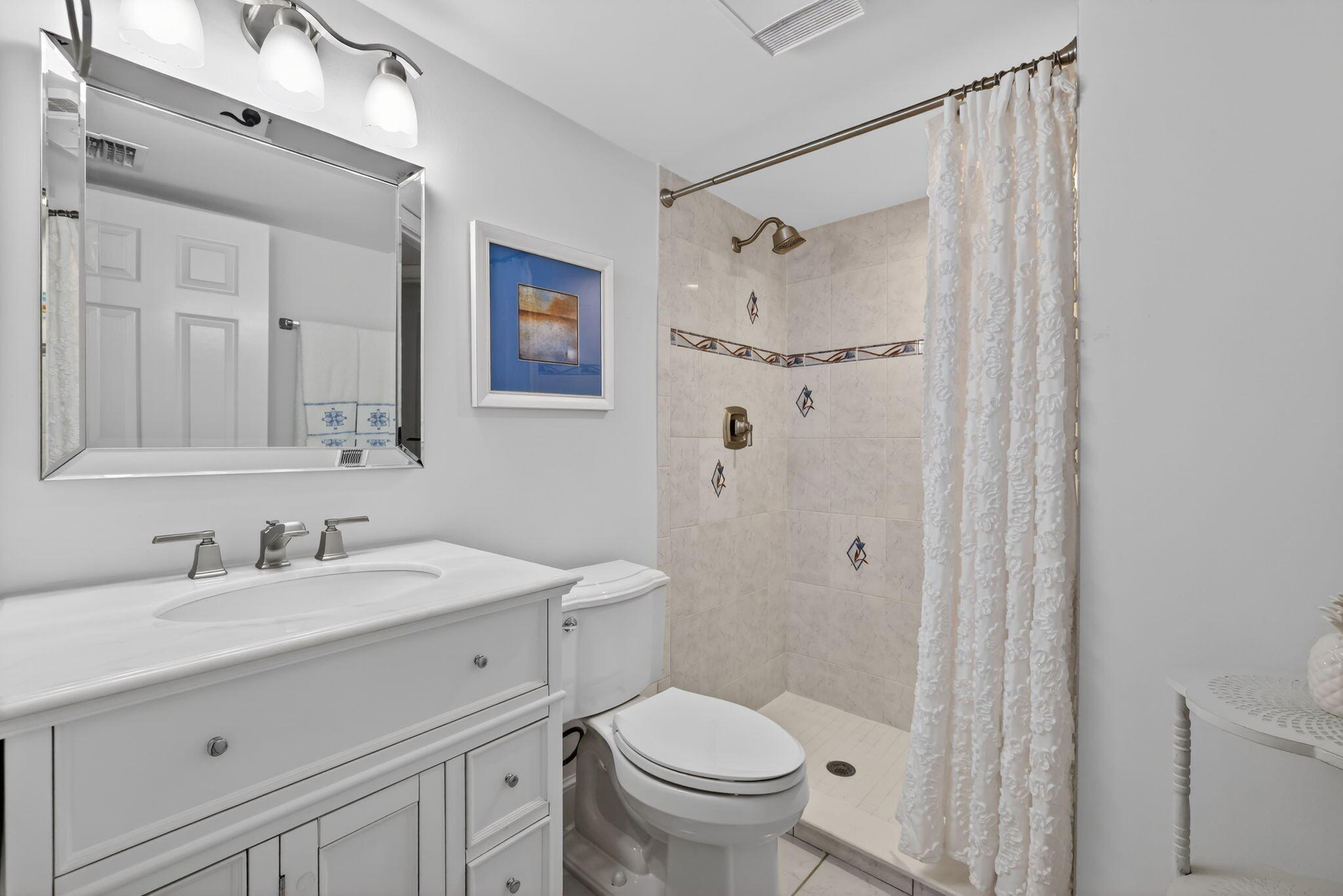 3401 Southeast Martinique Trace, Unit 102 Stuart, FL 34997 - Photo 31 of 56 a bathroom with a sink toilet and shower