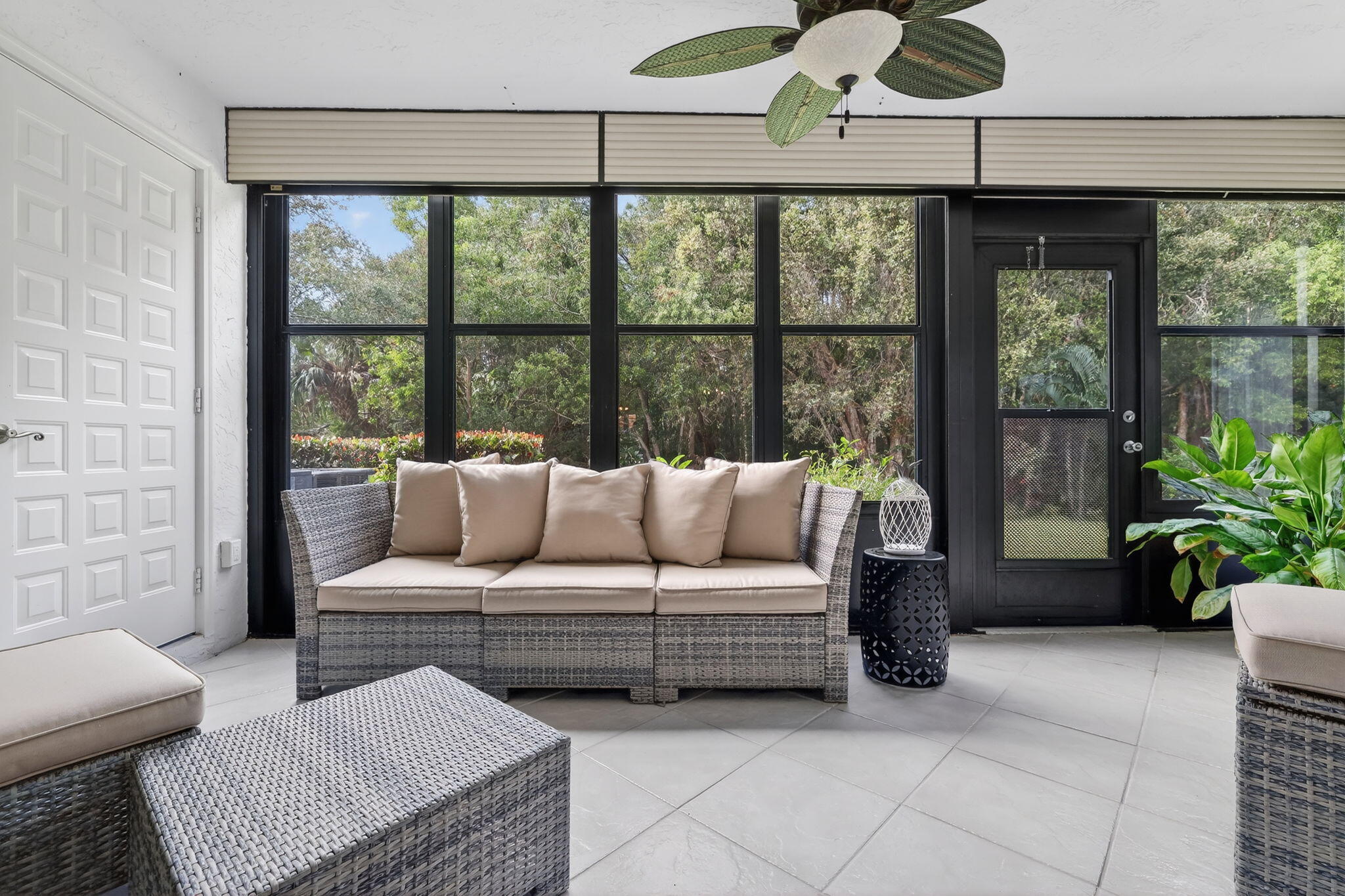 3401 Southeast Martinique Trace, Unit 102 Stuart, FL 34997 - Photo 33 of 56 a living room with furniture and a large window