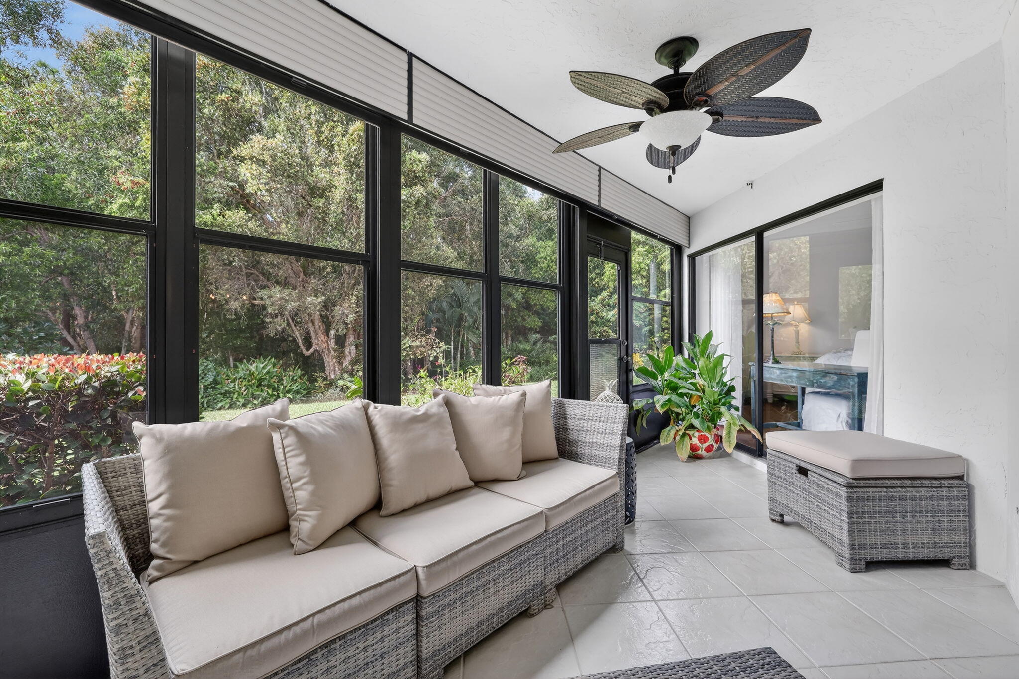 3401 Southeast Martinique Trace, Unit 102 Stuart, FL 34997 - Photo 36 of 56 a living room with furniture and a large window