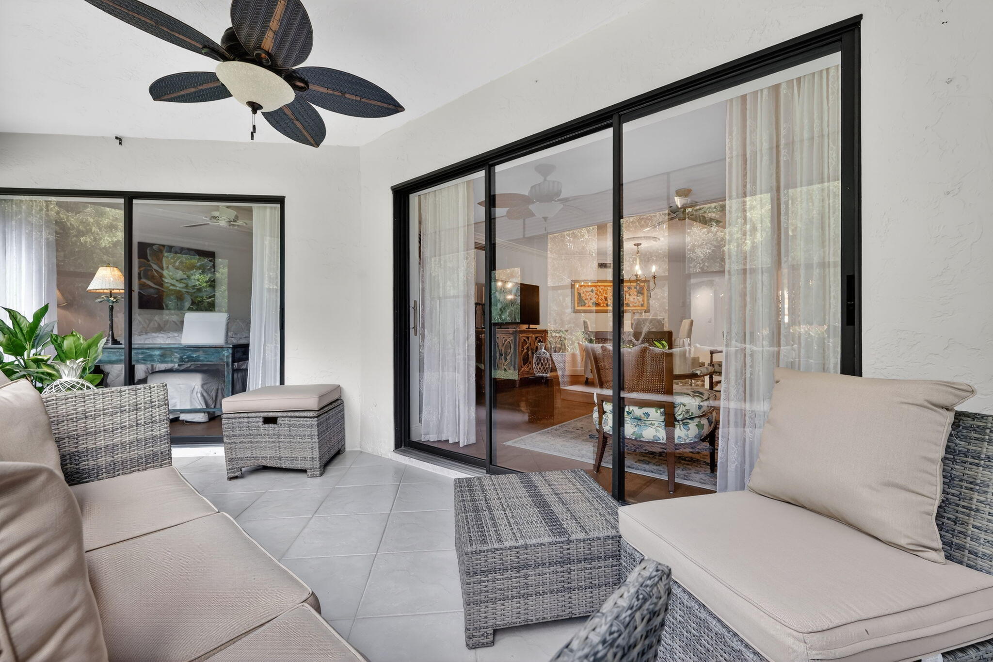 3401 Southeast Martinique Trace, Unit 102 Stuart, FL 34997 - Photo 37 of 56 a living room with furniture and a large window
