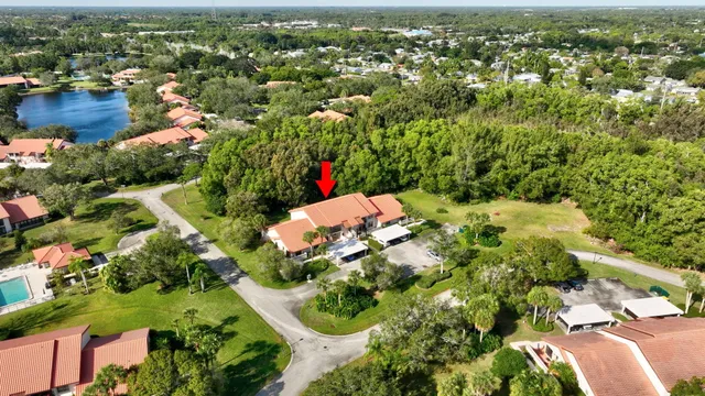 an aerial view of a house with swimming pool and outdoor space