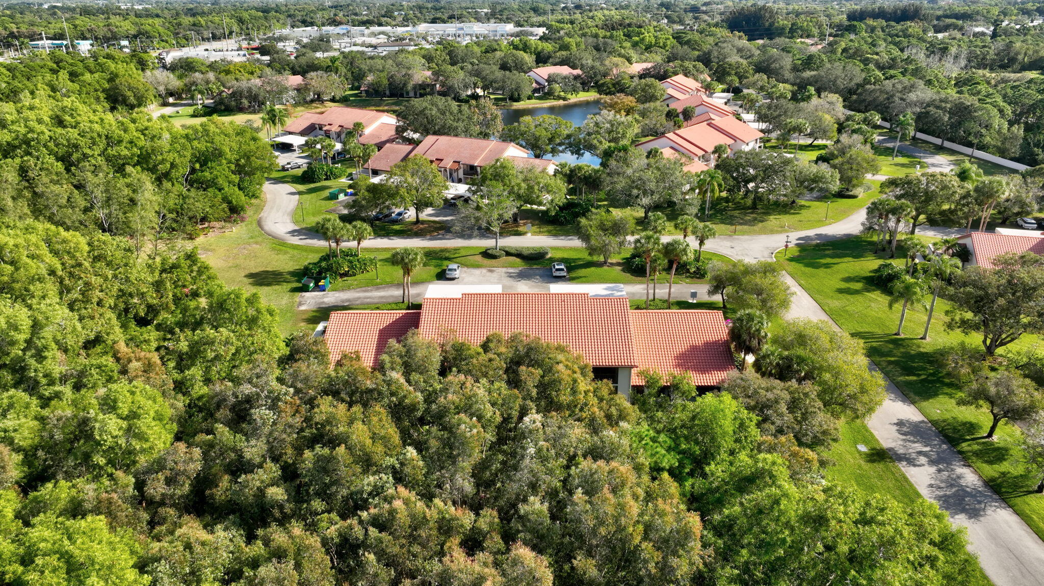 3401 Southeast Martinique Trace, Unit 102 Stuart, FL 34997 - Photo 50 of 56 an aerial view of a house with yard swimming pool and outdoor seating