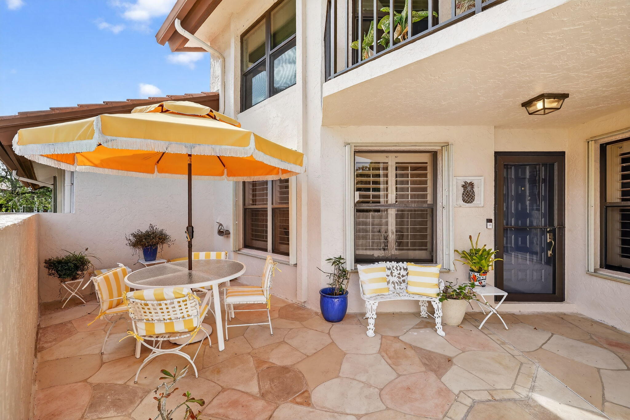 3401 Southeast Martinique Trace, Unit 102 Stuart, FL 34997 - Photo 5 of 56 a view of an outdoor seating area