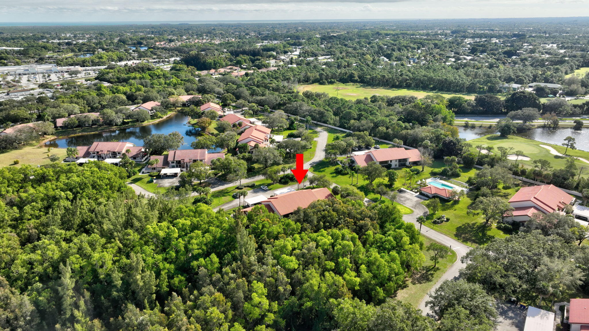 3401 Southeast Martinique Trace, Unit 102 Stuart, FL 34997 - Photo 52 of 56 an aerial view of multiple house