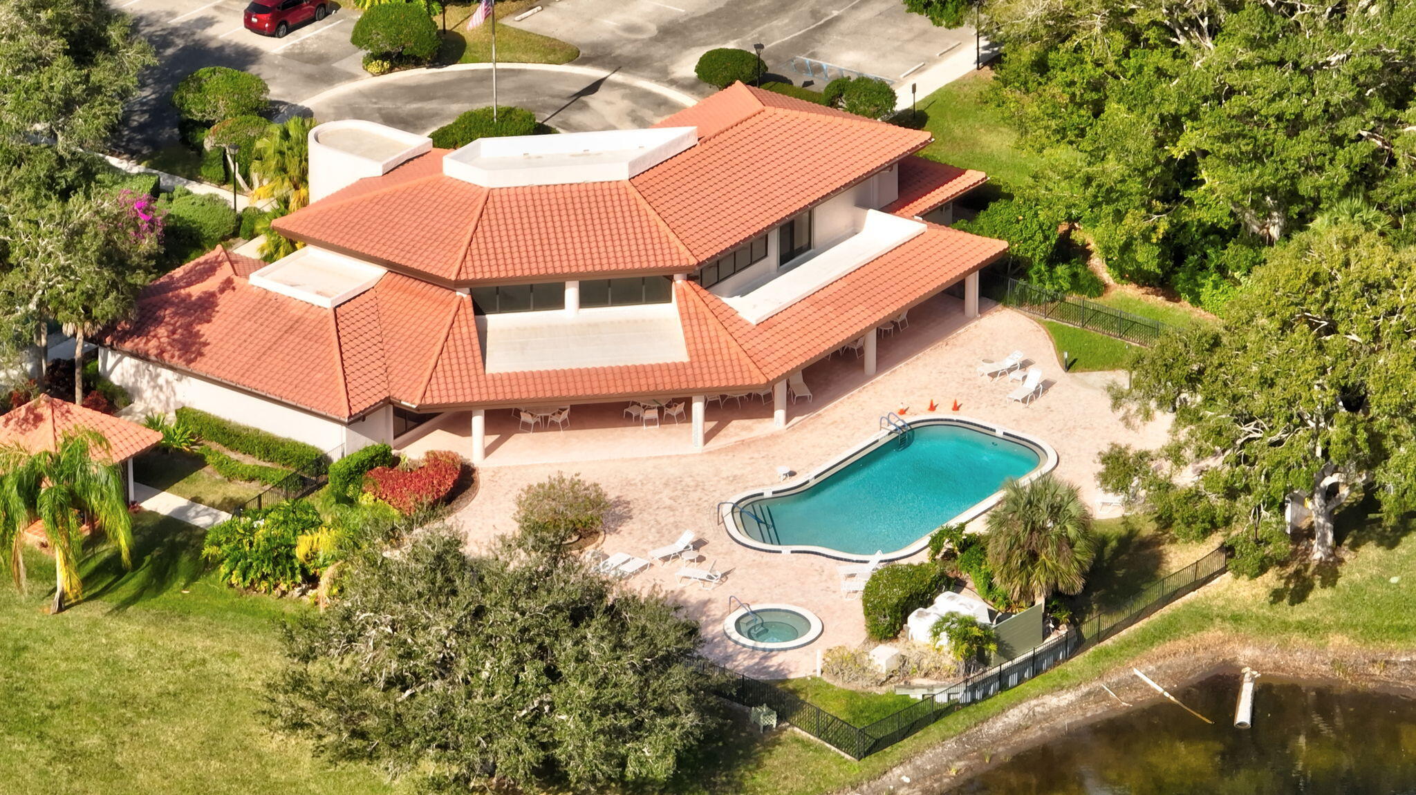 3401 Southeast Martinique Trace, Unit 102 Stuart, FL 34997 - Photo 55 of 56 an aerial view of a house with swimming pool and outdoor space