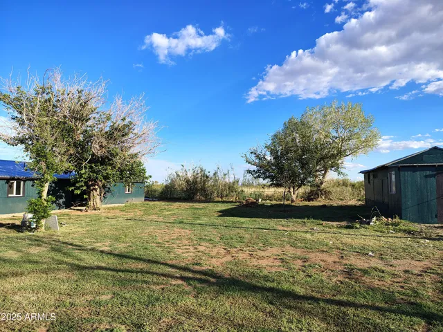 a view of a lake with a yard