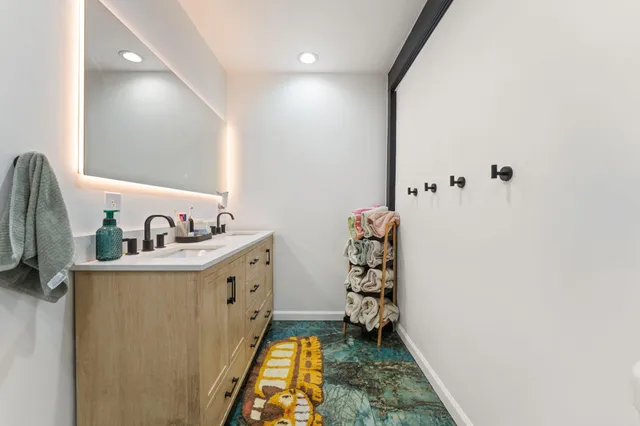 a bathroom with a sink and a mirror