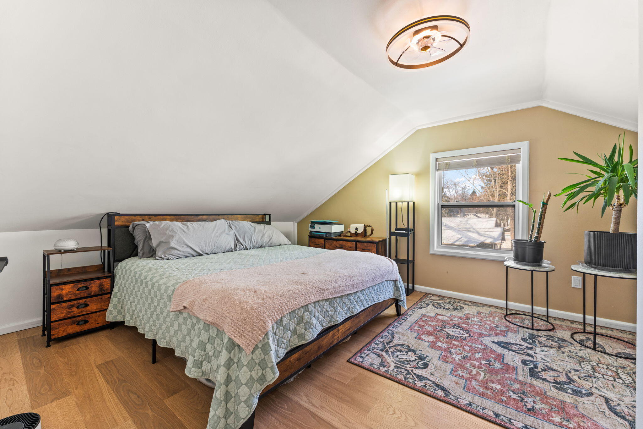 303 Union Street Valparaiso, IN 46383 - Photo 15 of 30 a spacious bedroom with a bed and a table in it