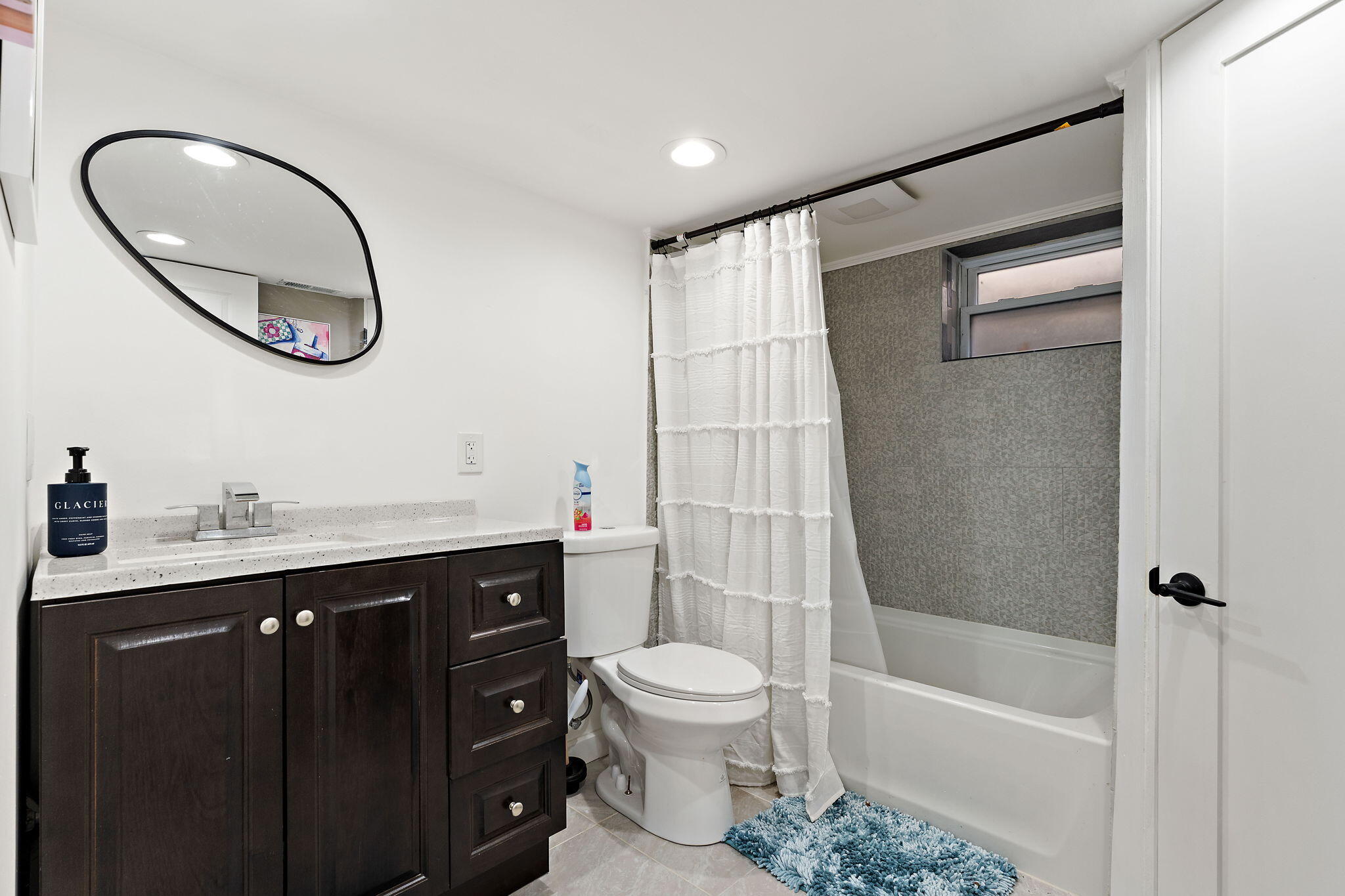 303 Union Street Valparaiso, IN 46383 - Photo 24 of 30 a bathroom with a toilet a sink and a mirror