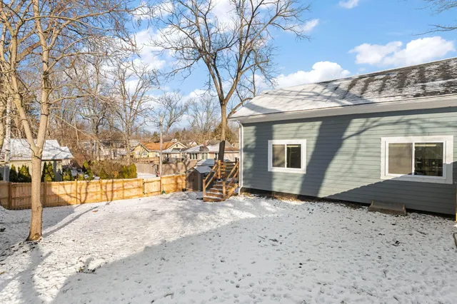 a view of a house with a snow in the yard