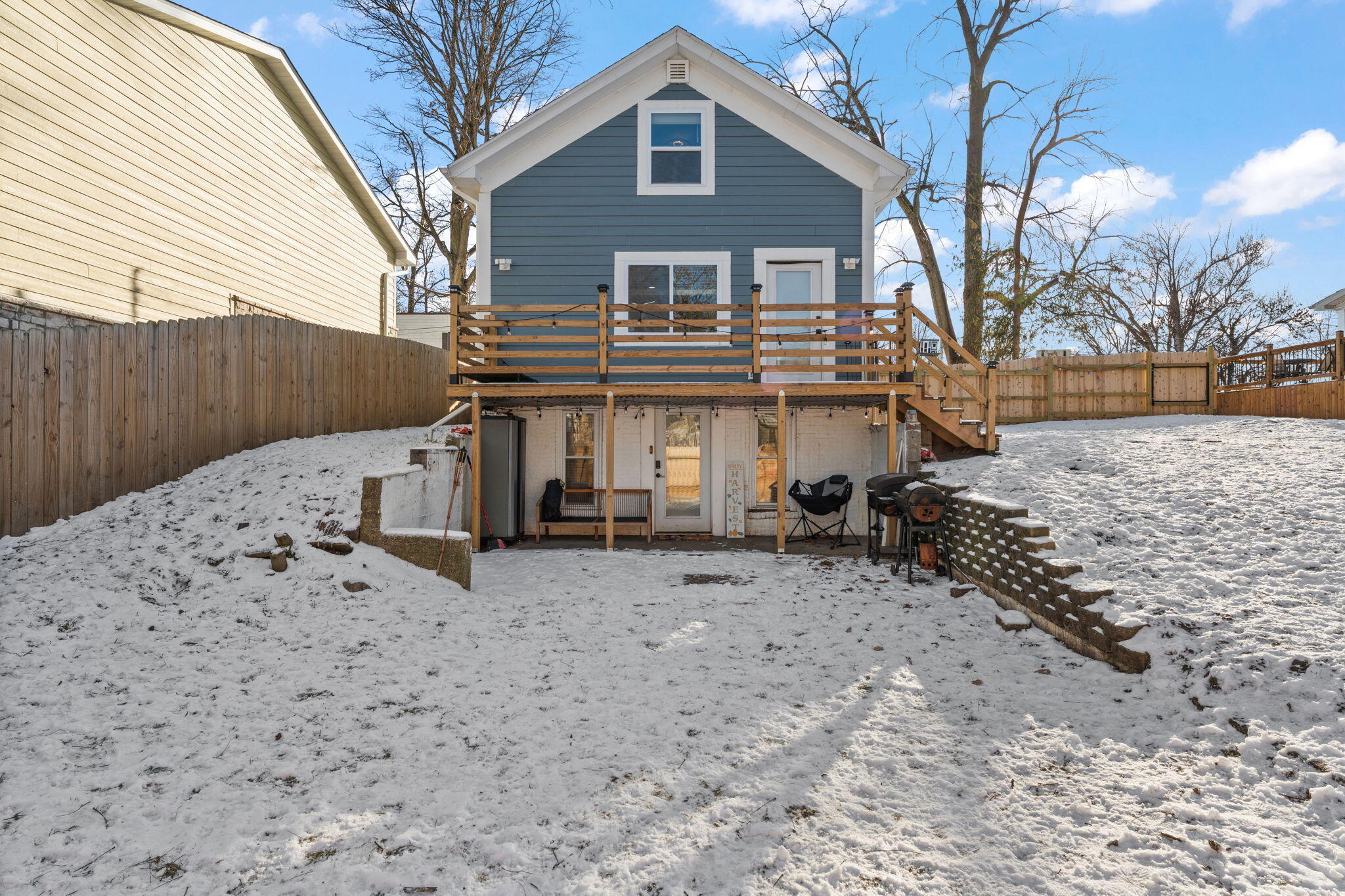 303 Union Street Valparaiso, IN 46383 - Photo 30 of 30 a front view of a house with a yard covered in snow