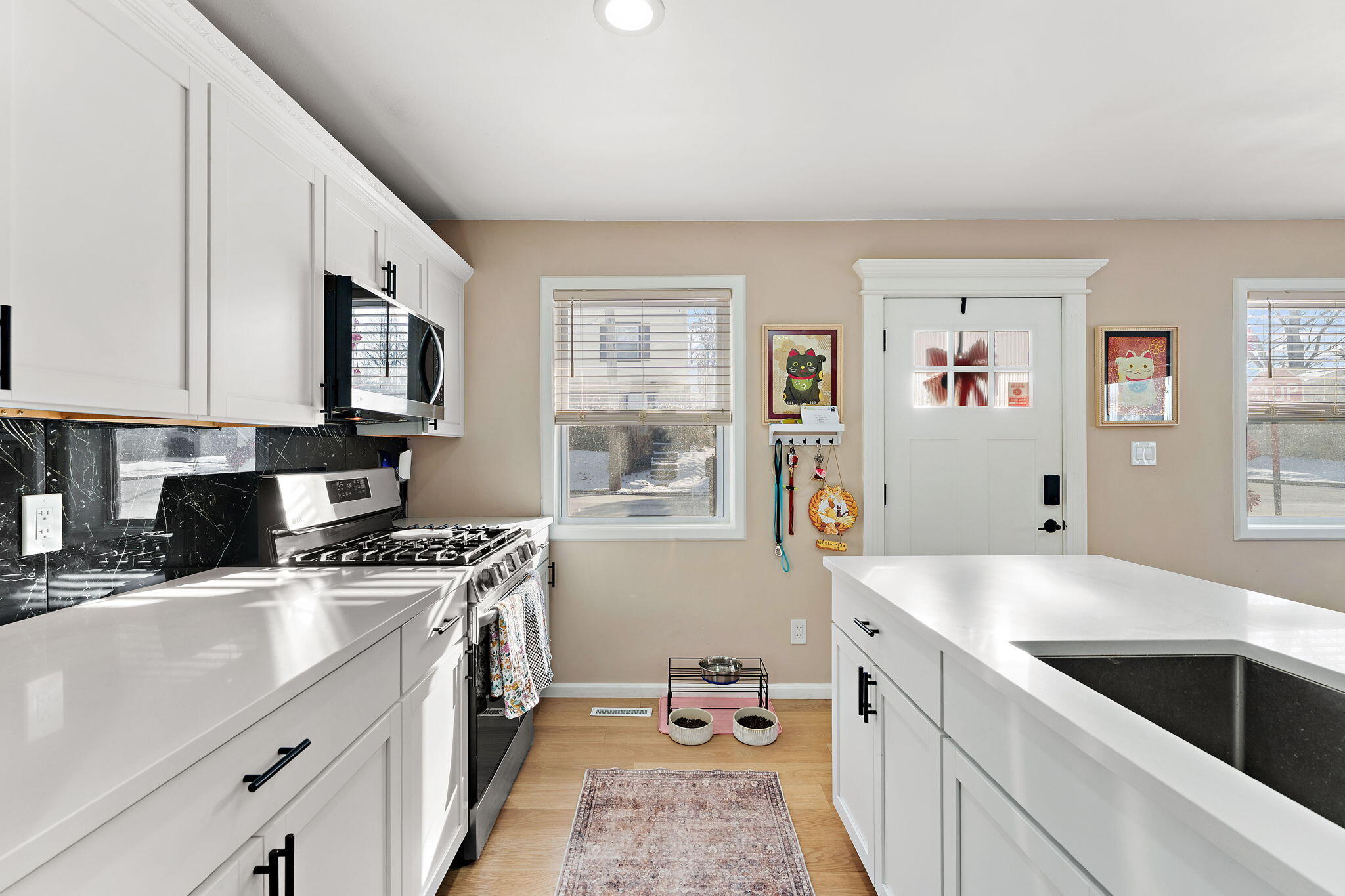 303 Union Street Valparaiso, IN 46383 - Photo 7 of 30 a kitchen with stainless steel appliances granite countertop a sink stove and refrigerator