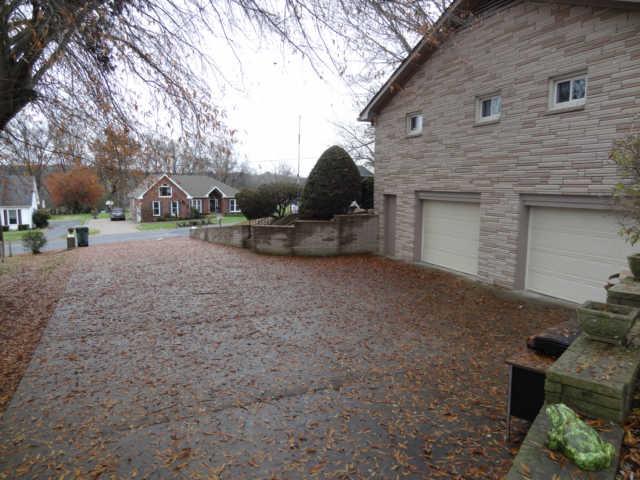 702 3rd Avenue West Springfield, TN 37172 - Photo 14 of 16 a view of a house with backyard and a tree