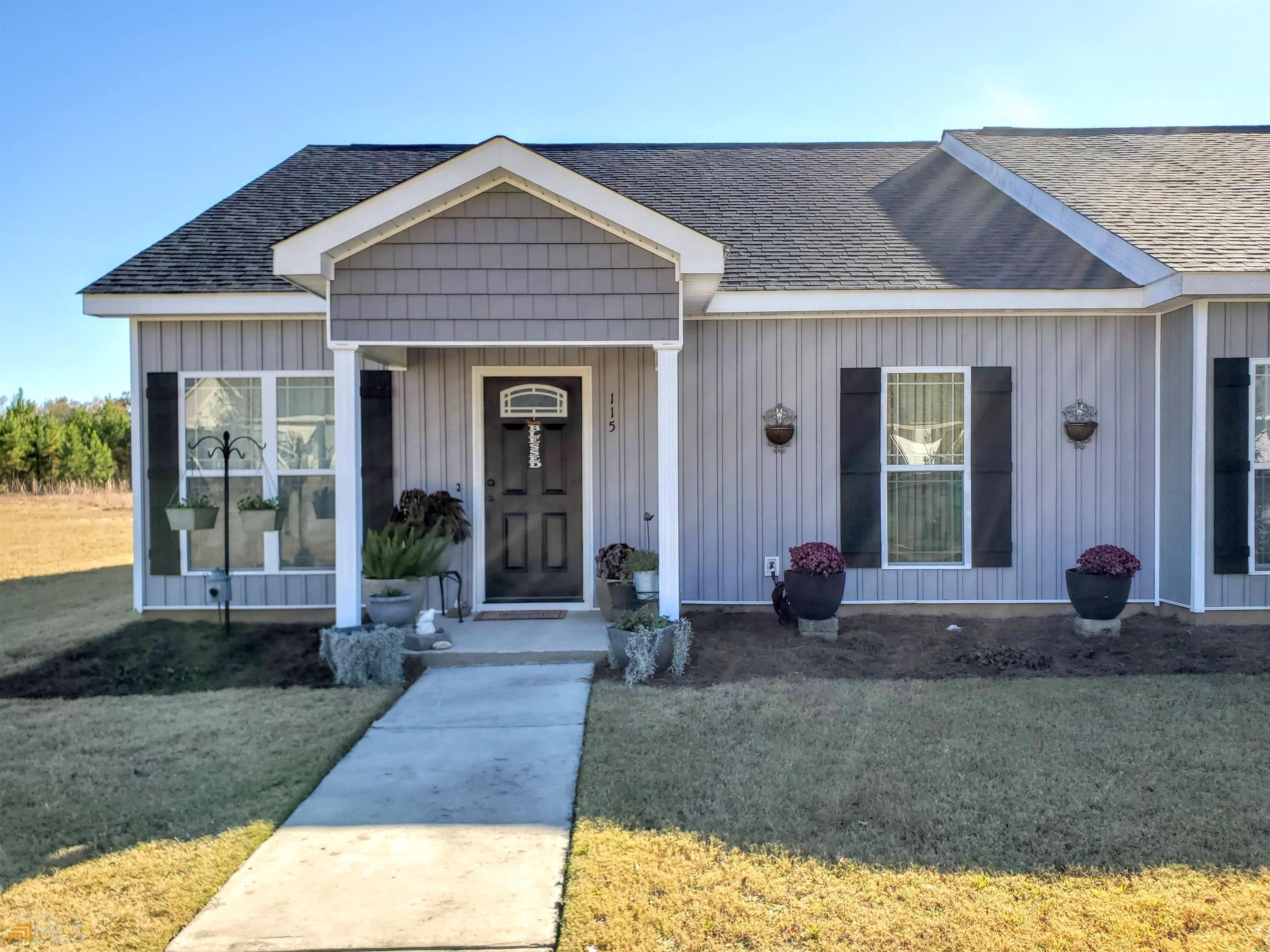 a front view of a house with garden