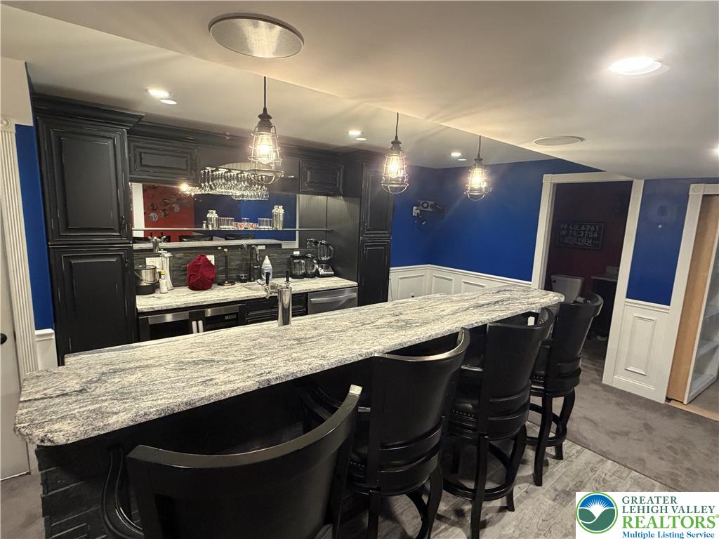 4157 Walter Road Bethlehem, PA 18020 - Photo 31 of 36 Craft a lively evening experience at this bar, featuring granite counters and pendant lighting.