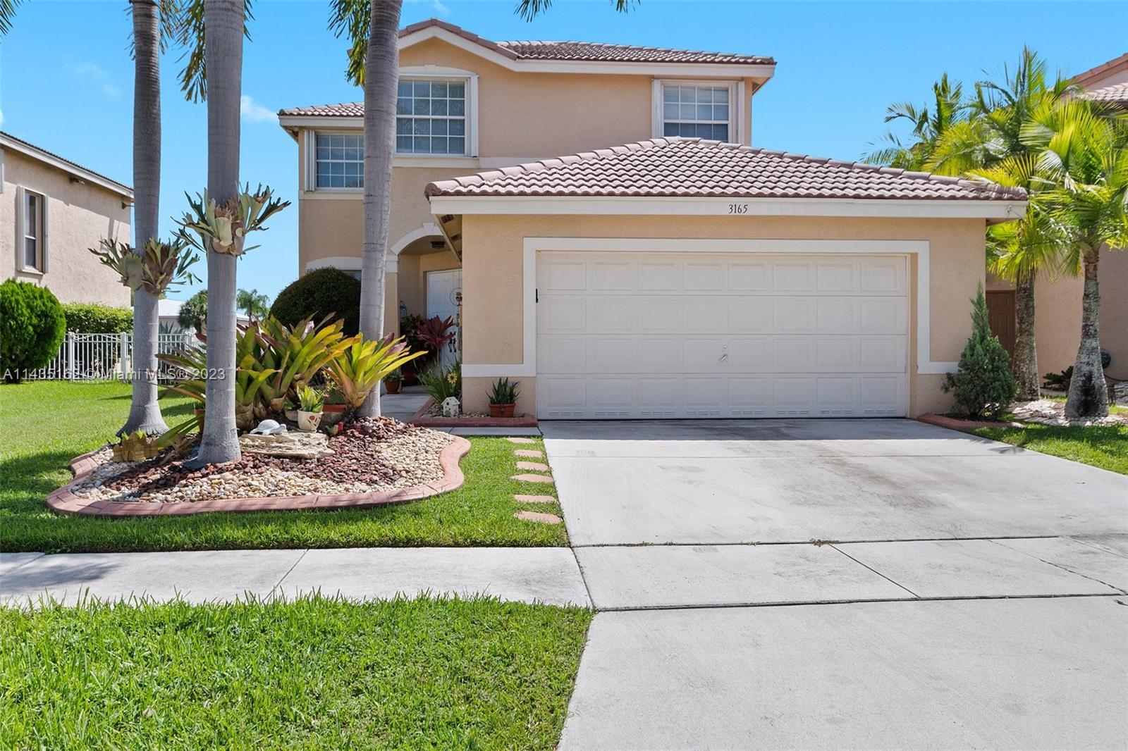 3165 Southwest 176th Way Miramar, FL 33029 - Photo 1 of 32 a front view of a house with a yard