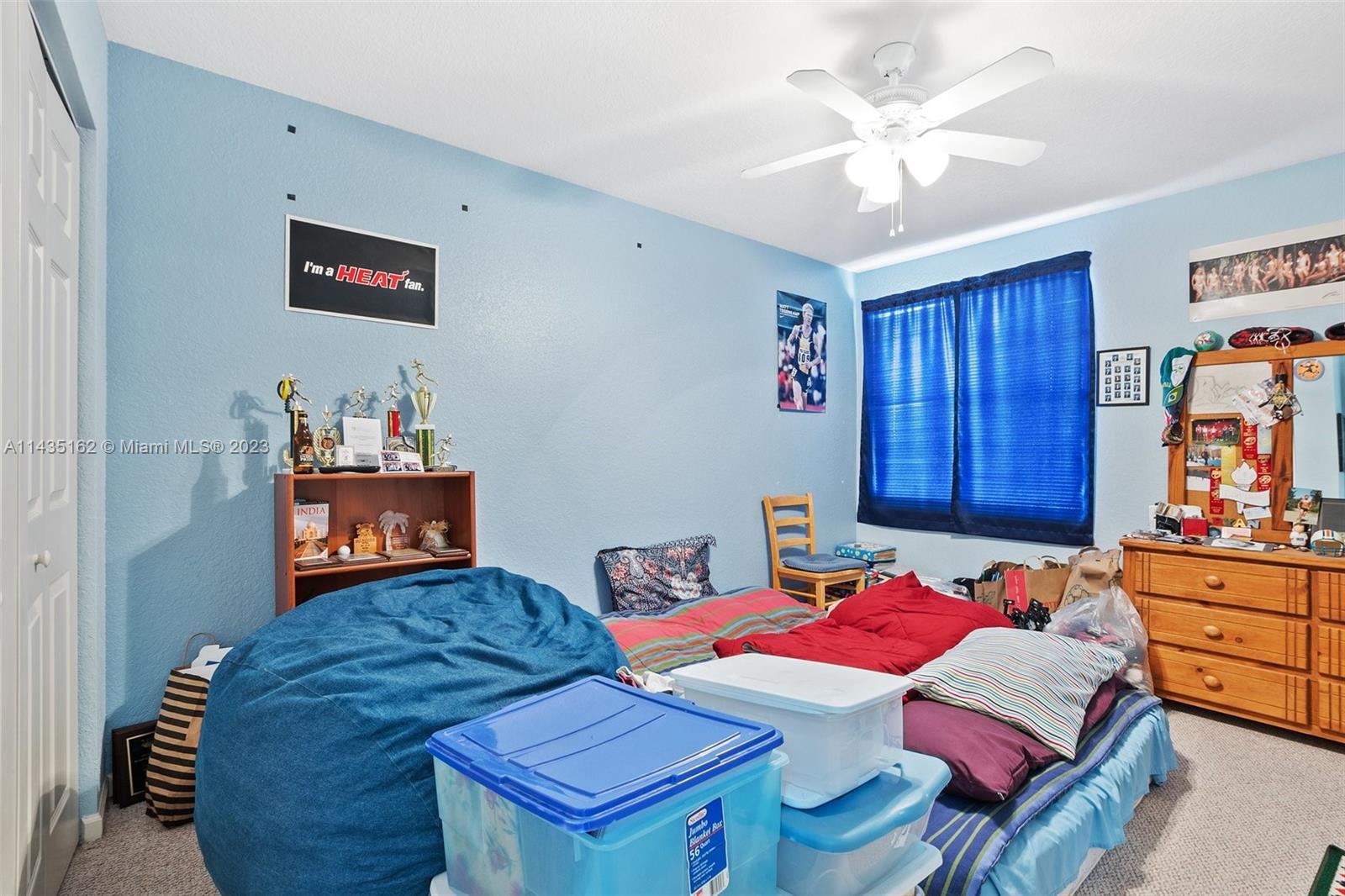 3165 Southwest 176th Way Miramar, FL 33029 - Photo 19 of 32 a bedroom with a bed and dresser