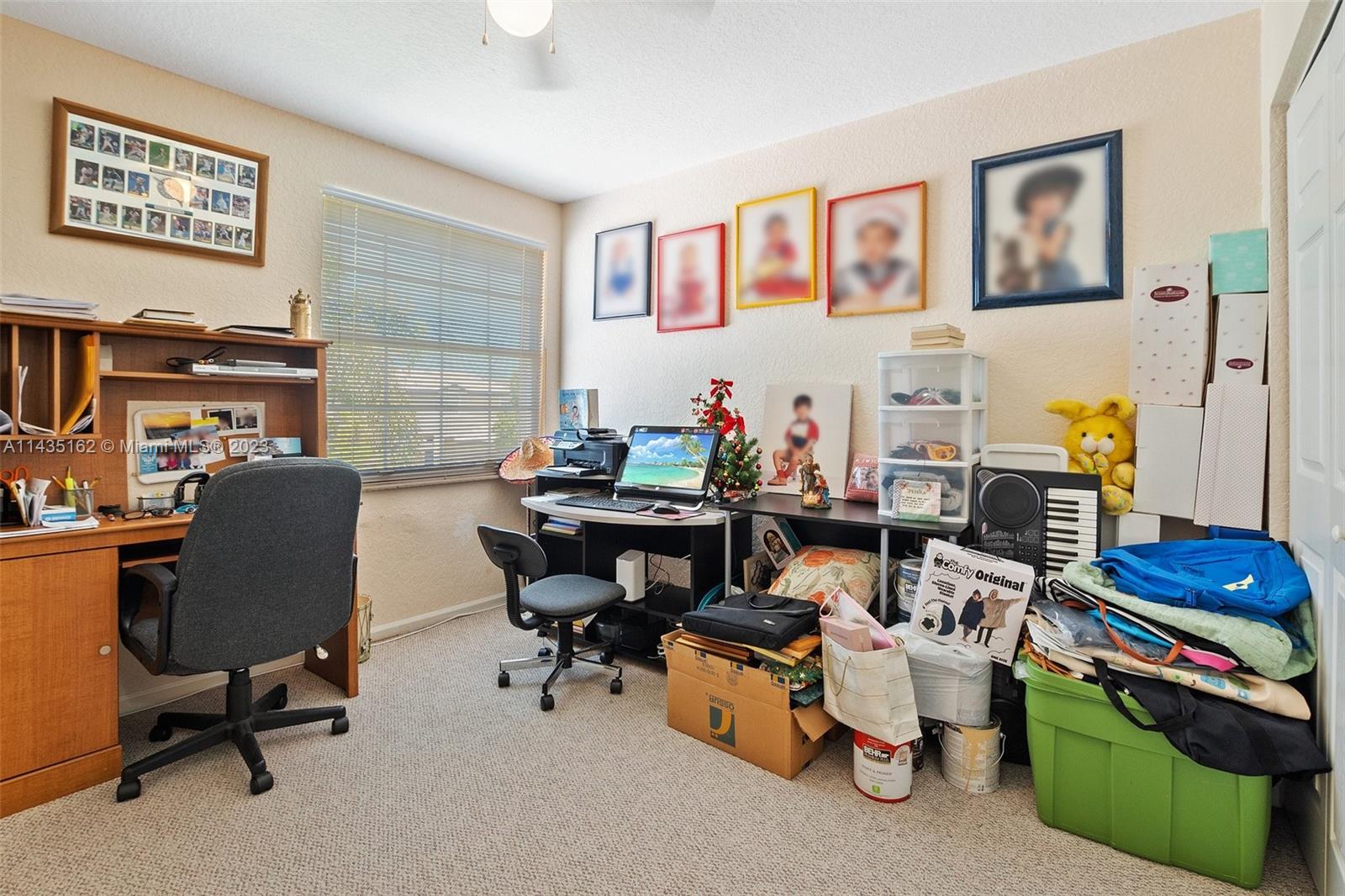 3165 Southwest 176th Way Miramar, FL 33029 - Photo 20 of 32 a room with furniture and a workspace