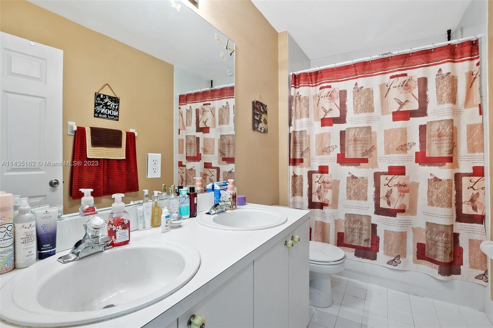 3165 Southwest 176th Way Miramar, FL 33029 - Photo 21 of 32 a bathroom with a sink toilet and shower