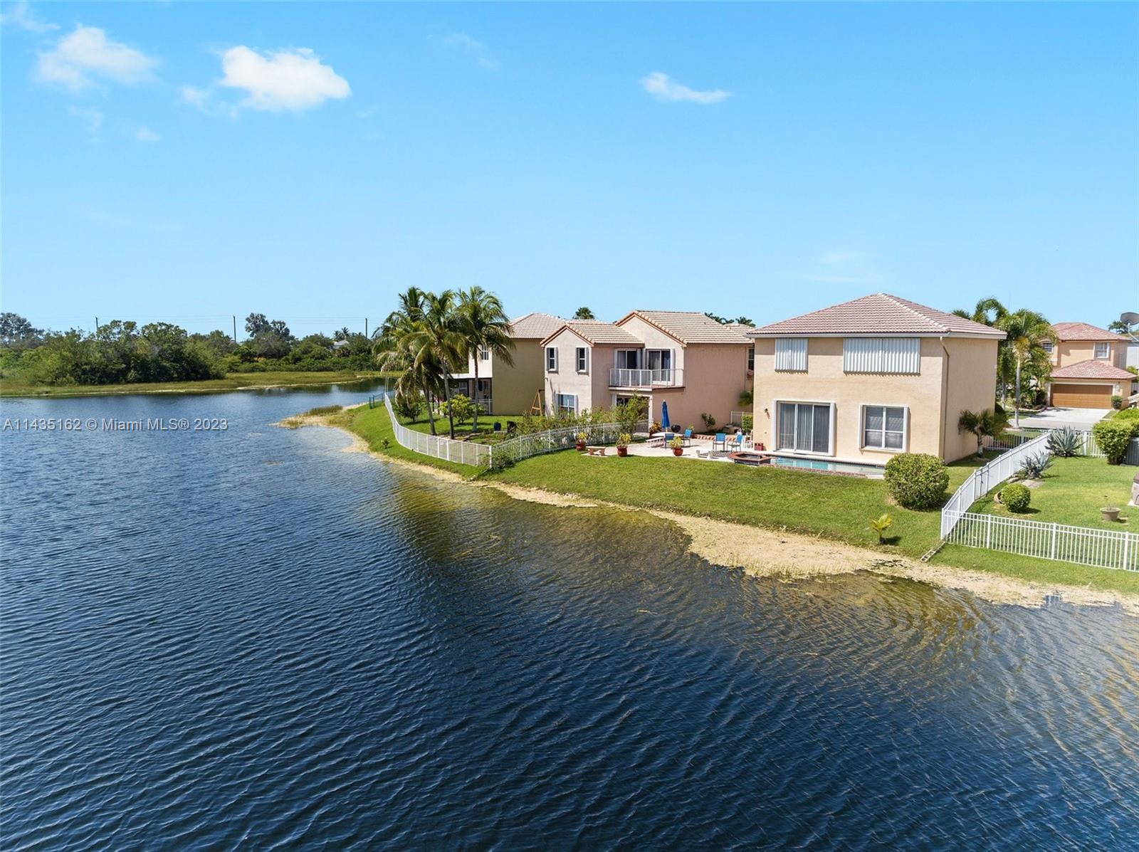 3165 Southwest 176th Way Miramar, FL 33029 - Photo 28 of 32 a view of house with garden and lake view