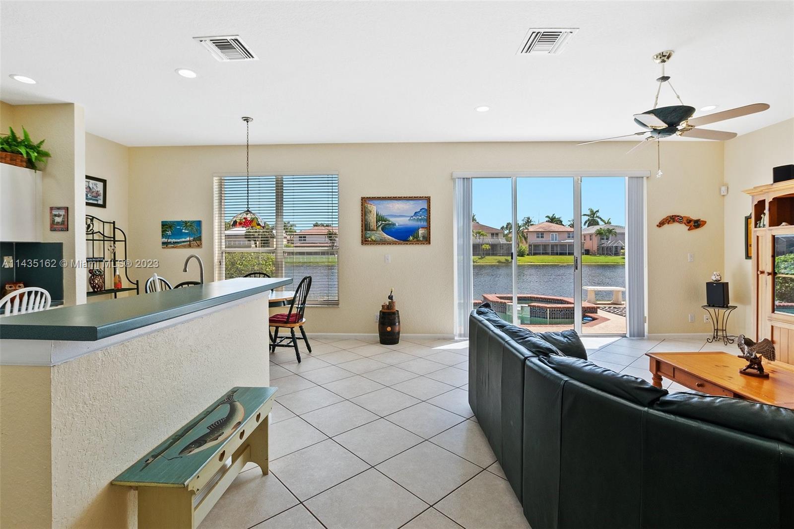 3165 Southwest 176th Way Miramar, FL 33029 - Photo 6 of 32 a kitchen with stainless steel appliances granite countertop a sink and a refrigerator
