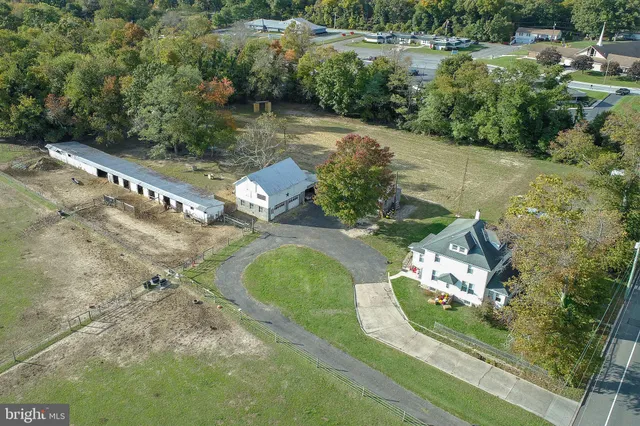 a aerial view of a house with swimming pool and porch