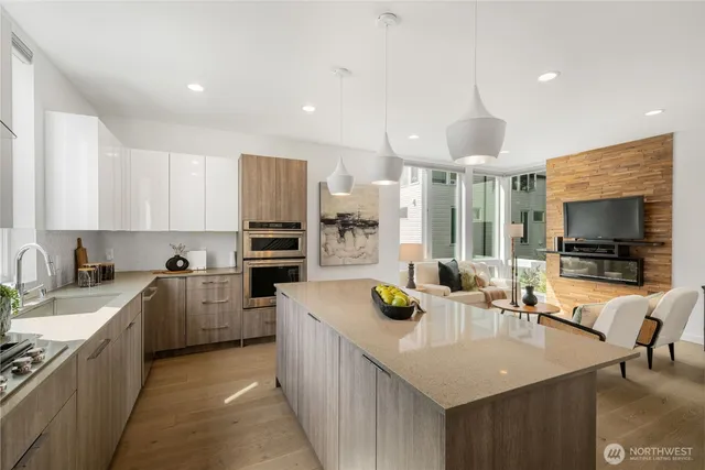 a kitchen with stainless steel appliances kitchen island granite countertop a sink and cabinets