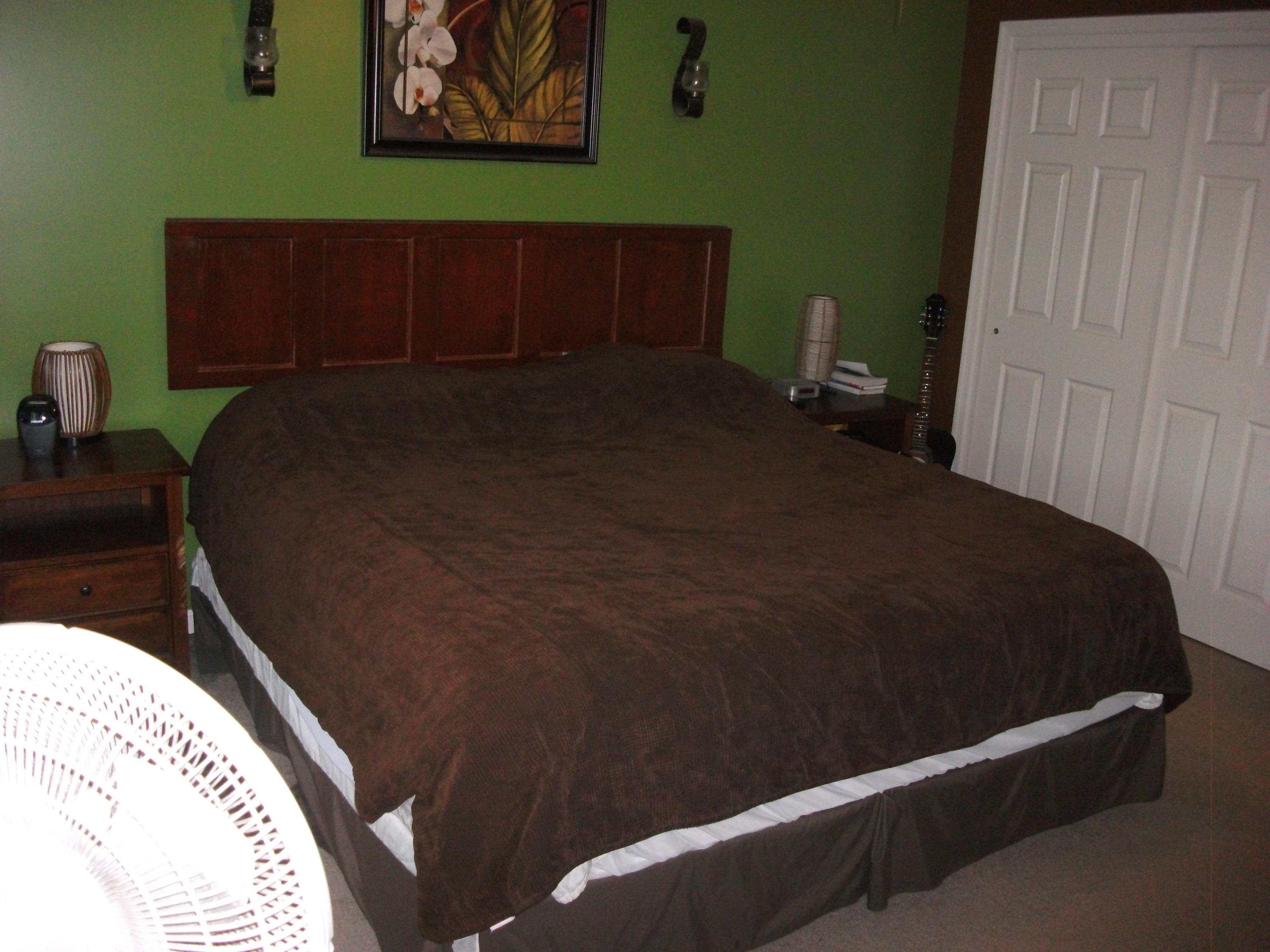 930 Calico Rock Road Rocky Mount, VA 24151 - Photo 13 of 34 a bed sitting in a bedroom next to a small yard