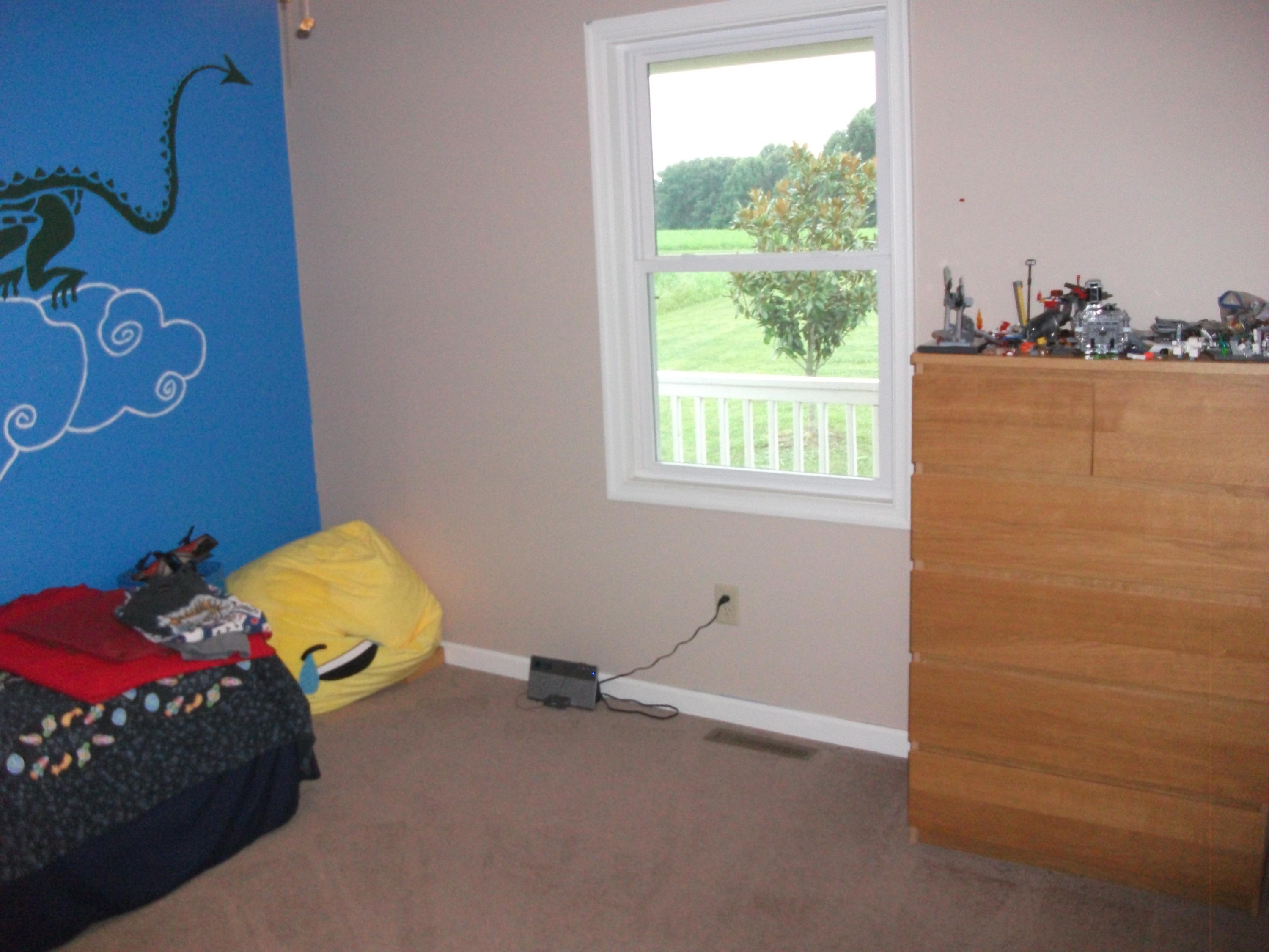930 Calico Rock Road Rocky Mount, VA 24151 - Photo 18 of 34 a bed sitting in a bedroom next to a window