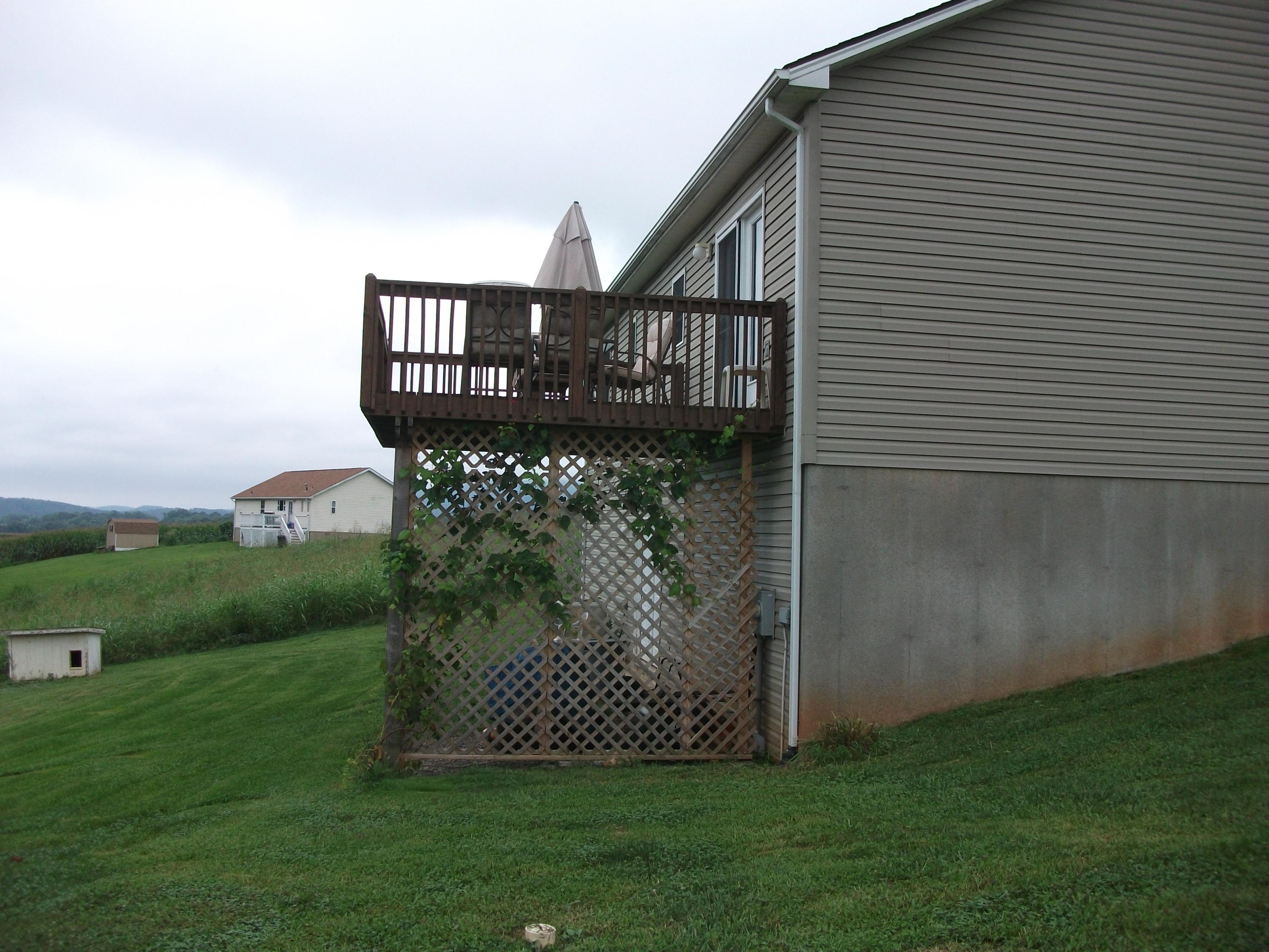 930 Calico Rock Road Rocky Mount, VA 24151 - Photo 23 of 34 a view of a wooden house with a yard