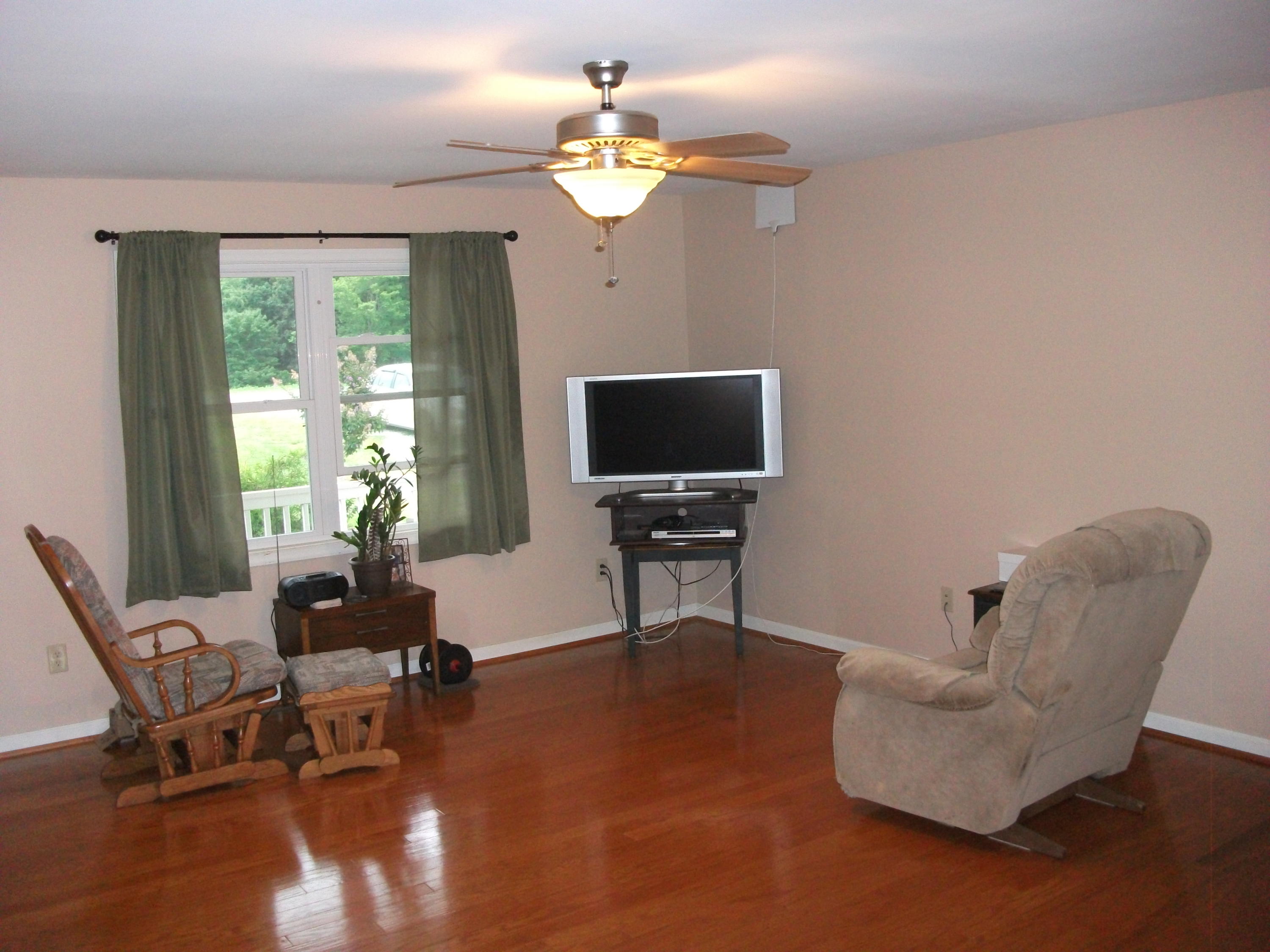 930 Calico Rock Road Rocky Mount, VA 24151 - Photo 4 of 34 a living room with furniture a ceiling fan and a window