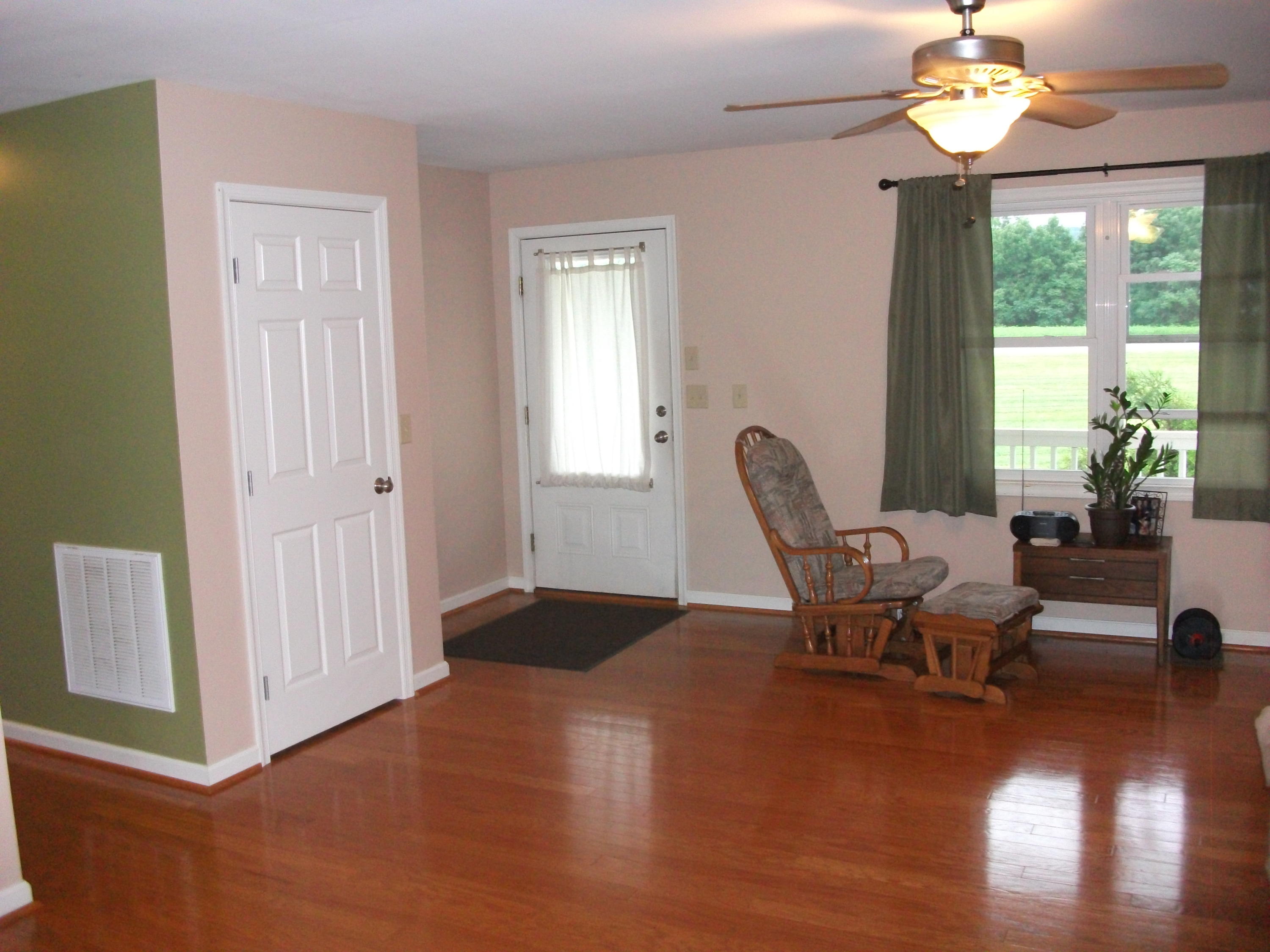 930 Calico Rock Road Rocky Mount, VA 24151 - Photo 5 of 34 a living room with furniture a window and a chandelier