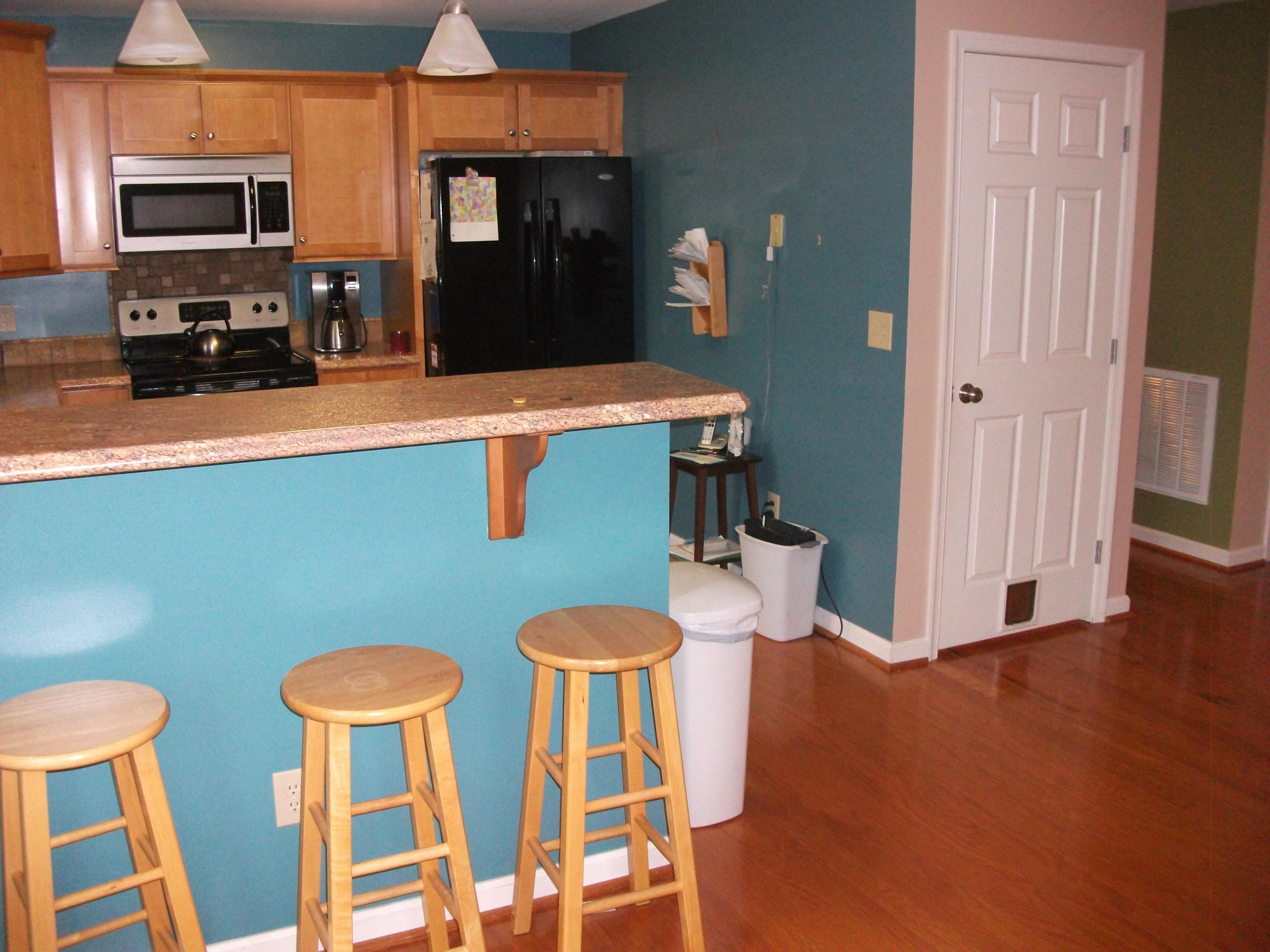 930 Calico Rock Road Rocky Mount, VA 24151 - Photo 9 of 34 a kitchen with stainless steel appliances dining table and chairs