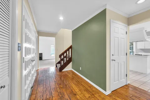 a view of empty room with fireplace and windows