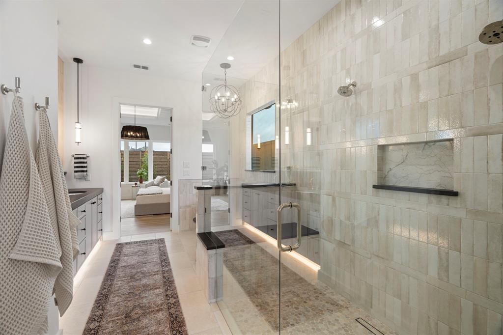 3316 Ferguson Road Grapevine, TX 76092 - Photo 20 of 39 a bathroom with a glass shower door