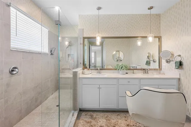 a spacious bedroom with a bed window and a table