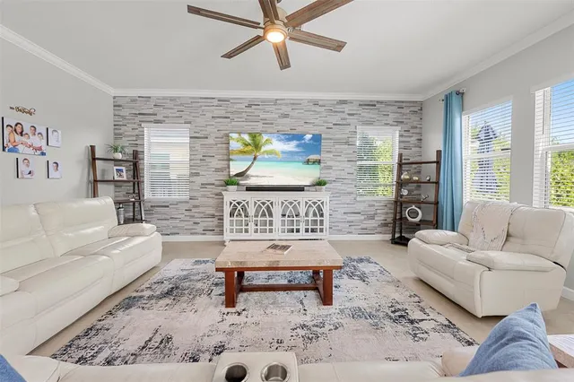 an aerial view of a house with swimming pool patio and outdoor seating