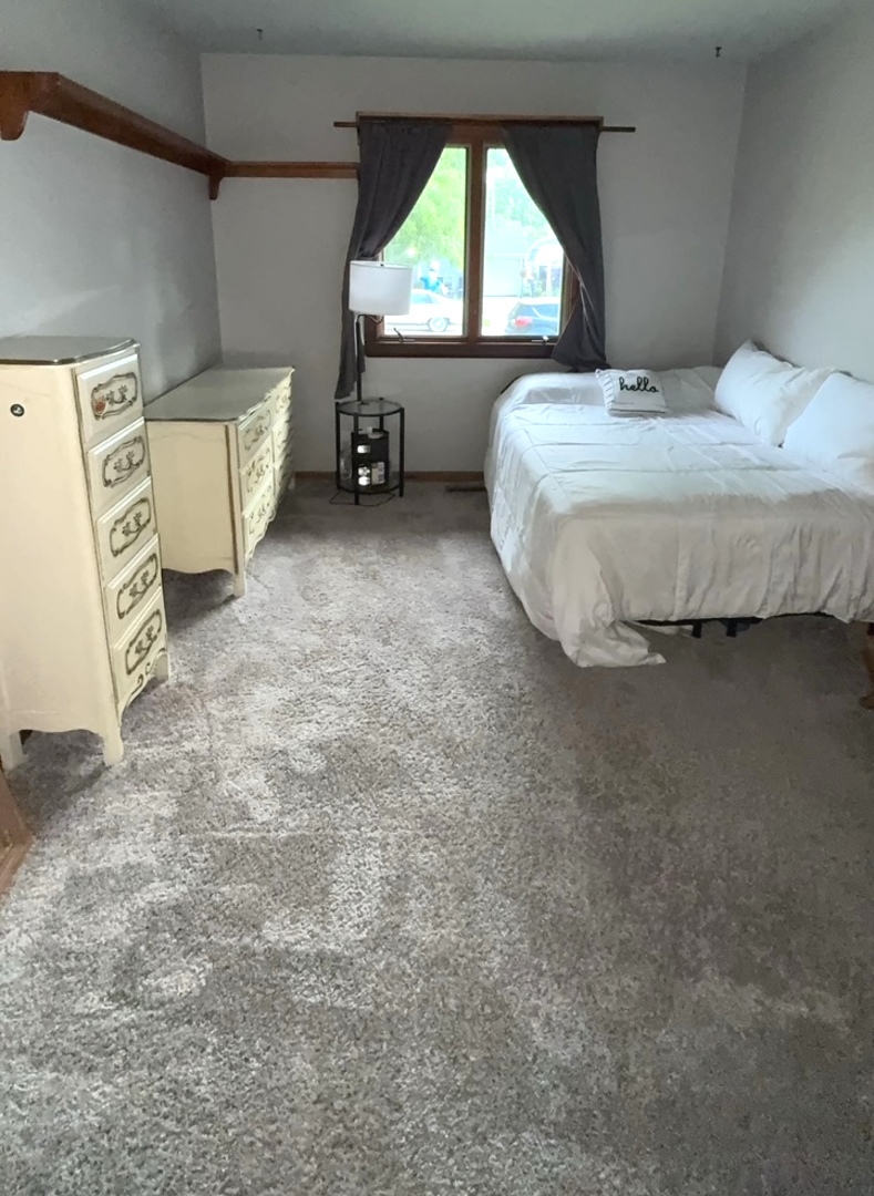 5199 Elmwood Road Oak Forest, IL 60452 - Photo 22 of 30 a bedroom with a bed and a window