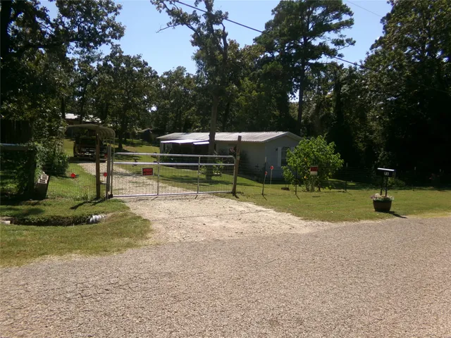 a view of a park with large trees