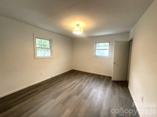 111 Dye Street Chester, SC 29706 - Photo 10 of 12 an empty room with wooden floor and windows