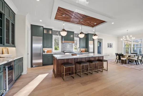 an open kitchen with a table and chairs in it
