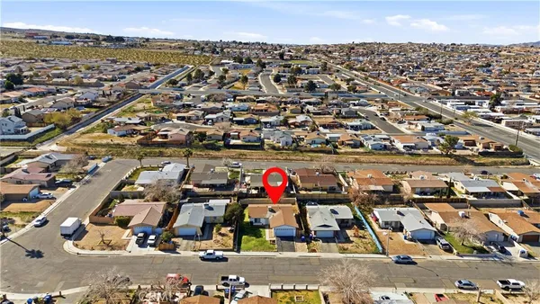 an aerial view of residential building with lake view