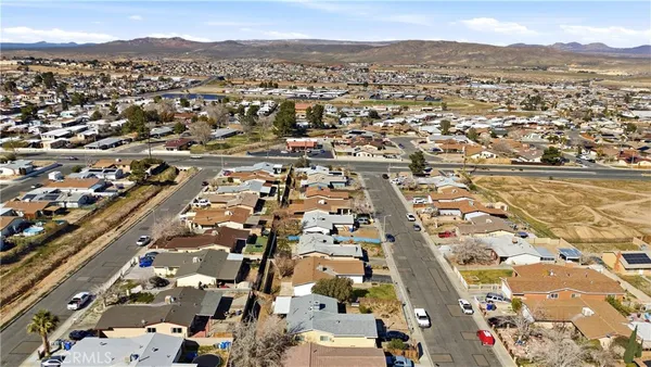 an aerial view of residential houses with outdoor space