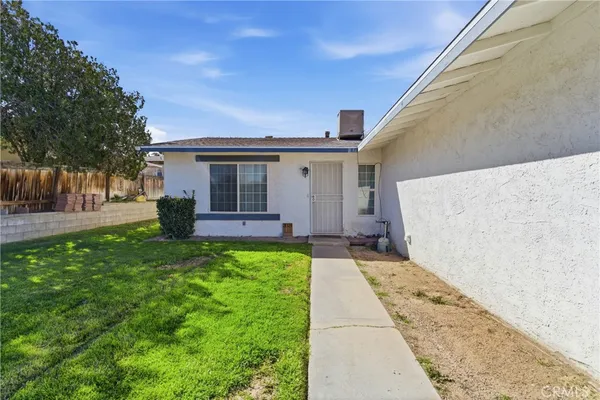 a view of a back yard of the house